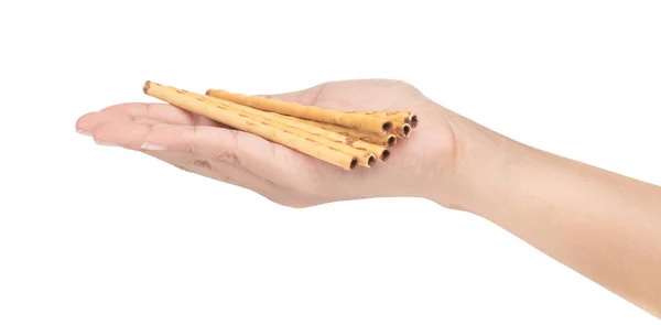 Hand holding salty cracker sticks isolated on white background — ストック写真