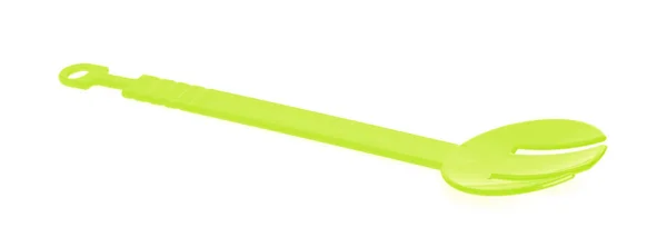 Green plastic kitchen utensil isolated on a white background — ストック写真