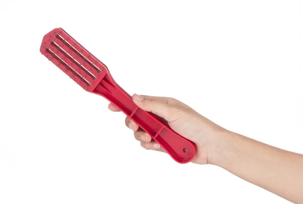 Hand holding plastic Fish Scale Cleaner Kitchen Tool isolated on — 图库照片