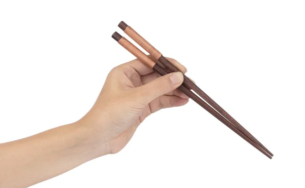 Tangan memegang sumpit Wooden terisolasi pada latar belakang putih — Stok Foto