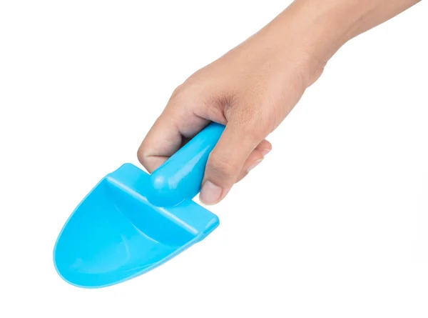 Hand holding Toy plastic blue of shovel isolated on a white back — Stockfoto