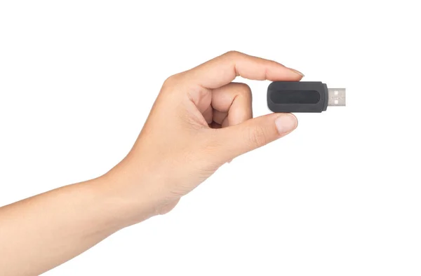 Mână care ține un negru de memorie flash USB izolat pe un bac alb — Fotografie, imagine de stoc