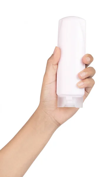 Рука держа бутылку кондиционера для волос изолированы на белом backgr — стоковое фото