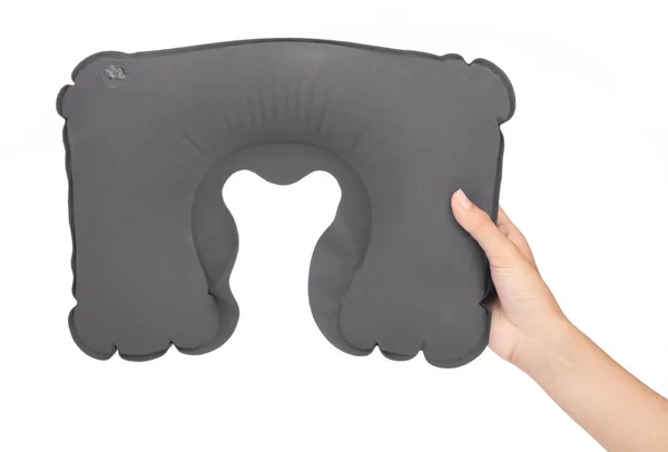 hand holding Grey neck pillow isolated on a white background