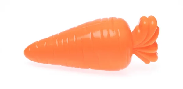 Plastic toy carrot isolated on white background — Stok fotoğraf