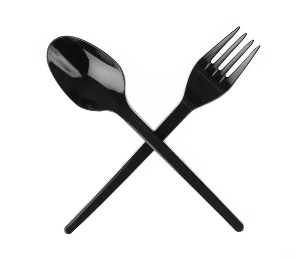 Cucchiaio e forchetta di plastica nera isolati su sfondo bianco . — Foto Stock