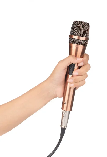 Hand holding golden microphone isolated on white background — 图库照片