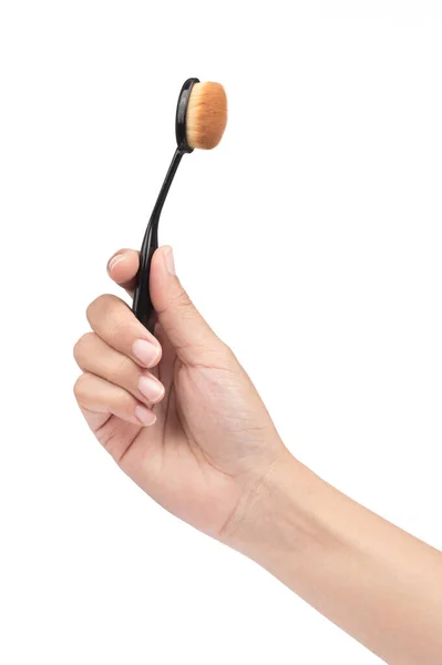 Hand holding Makeup Brush isolated on white background — Stock Photo, Image