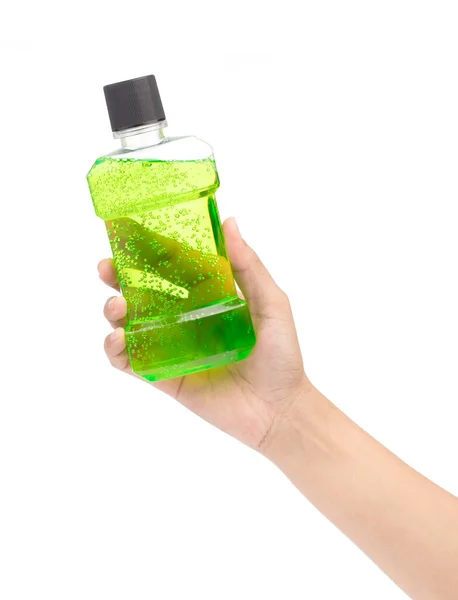 Hand holding Mouthwash in plastic bottle isolated on white backg — Stok fotoğraf