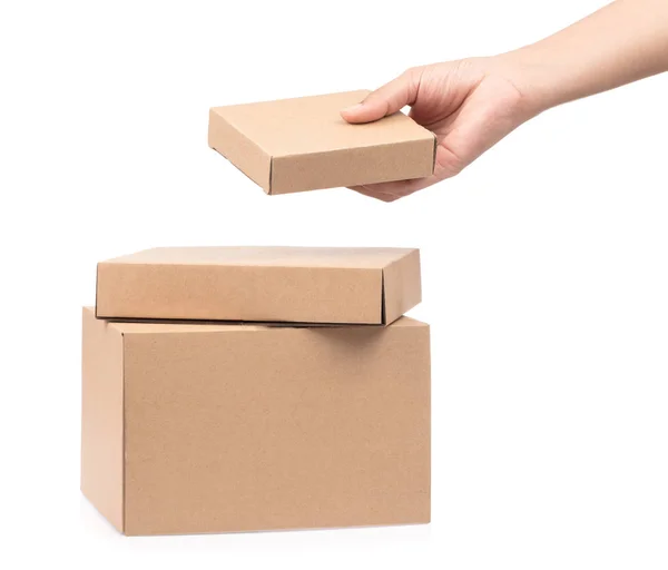 Hand hält Kisten gestapelt auf weißem Hintergrund. — Stockfoto