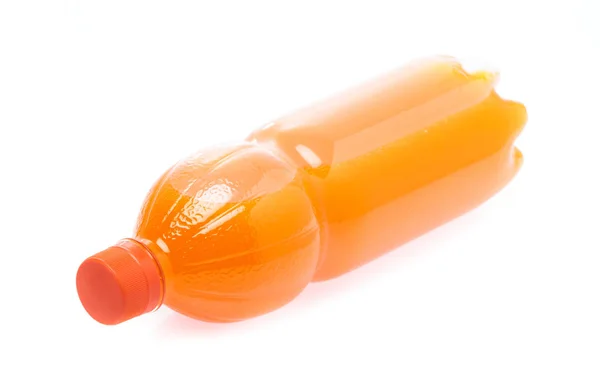 A bottle with tasty drink isolated on background — 스톡 사진