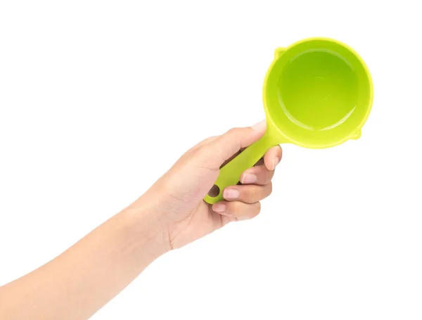 Hand holding green plastic scoop isolated on white background — Stock Photo, Image