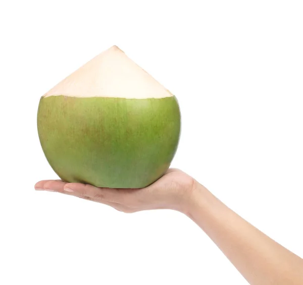 Mano sosteniendo fruta de coco aislada sobre fondo blanco — Foto de Stock