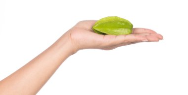 hand holding carambola, star fruit isolated on white background