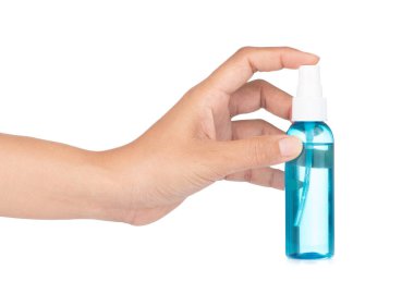 Handle a spray bottle to spray water mist in the air against a w