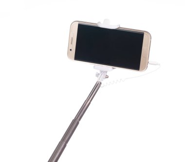 selfie stick with  mobile phone isolated on a white background