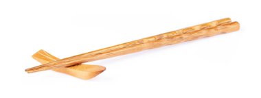 pair of wood chopsticks with wood holder isolated on a white bac