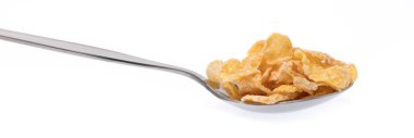 Cereal on spoon isolated on white background.