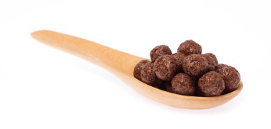 Cereal chocolate balls on spoon isolated on white background