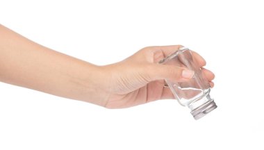 hand holding bottle glass for seasoning isolated on white backgr