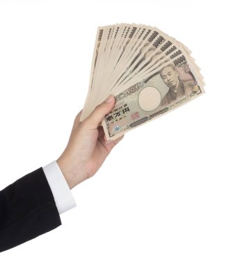 Businesswoman giving money and holding 10,000 japanese yen money