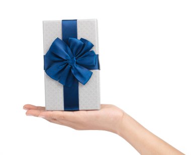 hand holding a Gift color silver box with blue ribbon and bow is