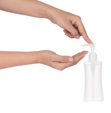 Hand holding Plastic bottle pump head isolated on white backgrou