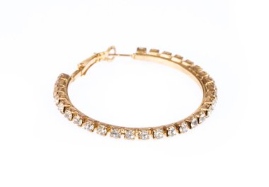 Beautiful golden earring with diamond isolatted on white backgro