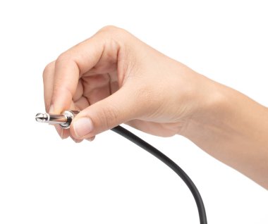 hand holding Audio jack connection of microphone isolated on whi