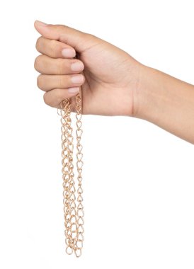 Hand holding gold chain isolated on a white background