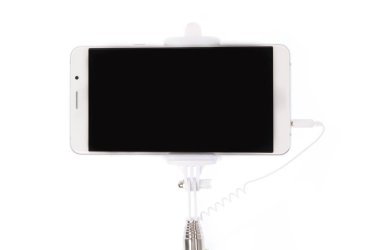 selfie stick with  mobile phone isolated on a white background