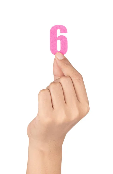 Hand holding Number 6 made of felt isolated on white background — Stockfoto