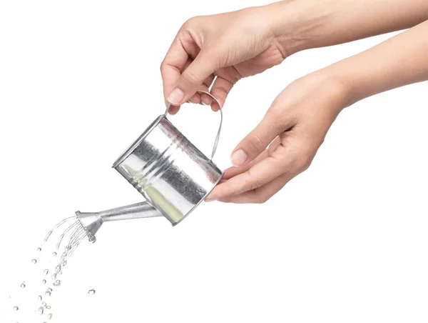 Hand holding a small metal watering can with spout isolated on w — 图库照片