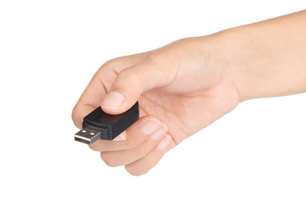 Mano sosteniendo un negro de memoria flash USB aislado en un bac blanco —  Fotos de Stock