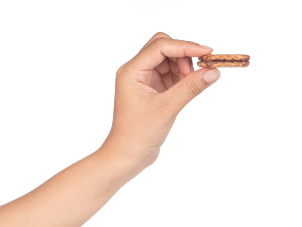 Ruka drží čokoládové sušenky izolované na bílém pozadí — Stock fotografie