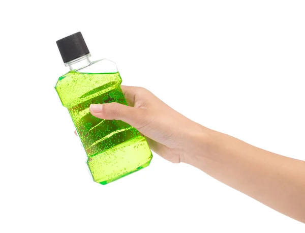 Hand holding Mouthwash in plastic bottle isolated on white backg — Stok fotoğraf