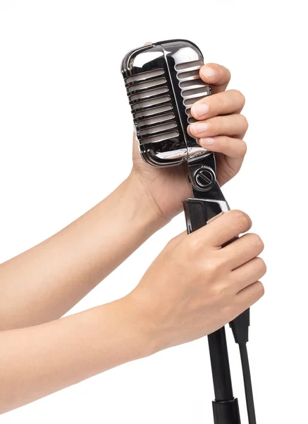 Hand holding a single retro microphone isolated on white backgro — ストック写真