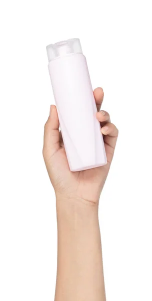 Hand holding bottle of hair conditioner isolated on white backgr