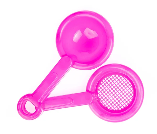 Hand holding Toy plastic pink of shovel isolated on a white back — Stok fotoğraf