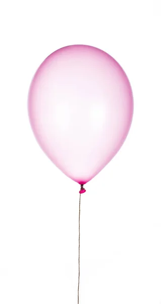 Balão de borracha roxa isolado em um fundo branco . — Fotografia de Stock