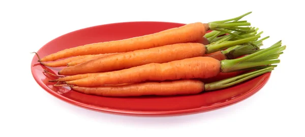 Fresh baby carrots on dish isolated on white background — Stock Photo, Image