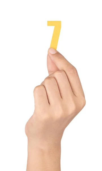 Mão segurando Número 7 feito de feltro isolado no fundo branco — Fotografia de Stock