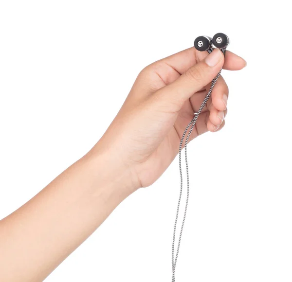 Hand holding Earphones isolated on a white background — ストック写真