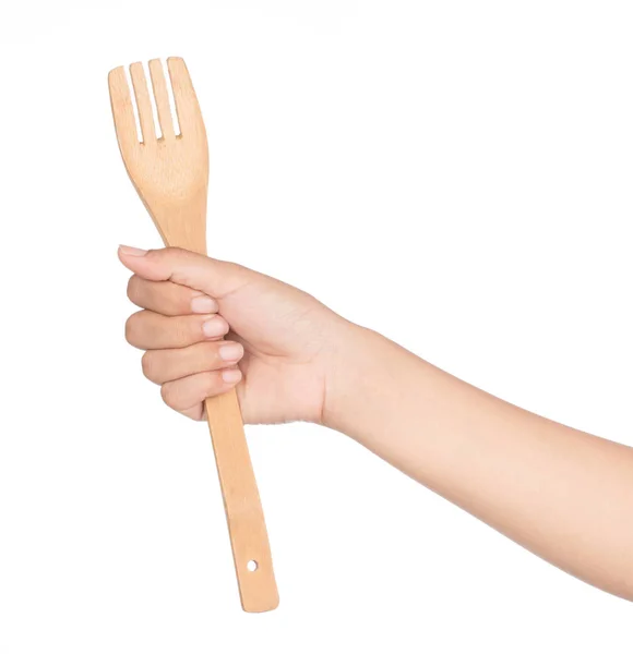 Hand holding wooden fork isolated on white background — 스톡 사진