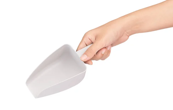 Hand hält Plastic Scooper Isoliert auf weißem Hintergrund. — Stockfoto