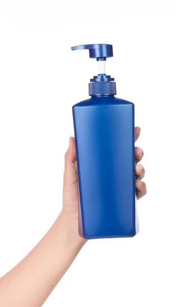 Una mano tenuta blu di shampoo bottiglia isolato su backgrou bianco — Foto Stock