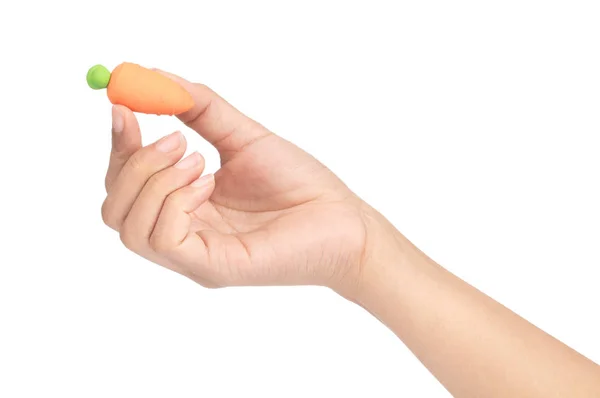 Hand holding carrot of rubber erasers isolated on white backgrou — Stock Photo, Image