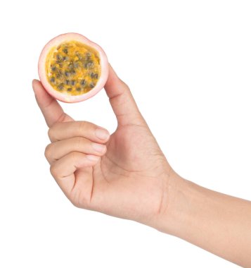 Hand holding slice Passion fruit isolated on the white backgroun