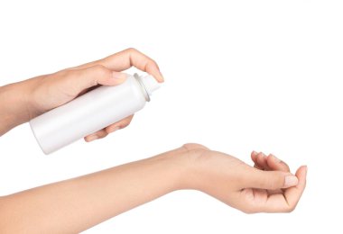 hand of a girl applied a sunscreen spray isolated on white backg