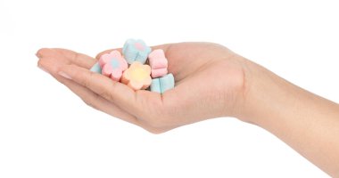 hand holding sweet marshmallow in the shape of flower isolated o